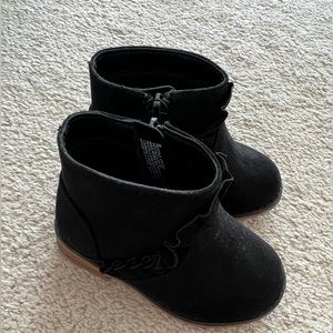 Black zip up booties with ruffles. Size 5